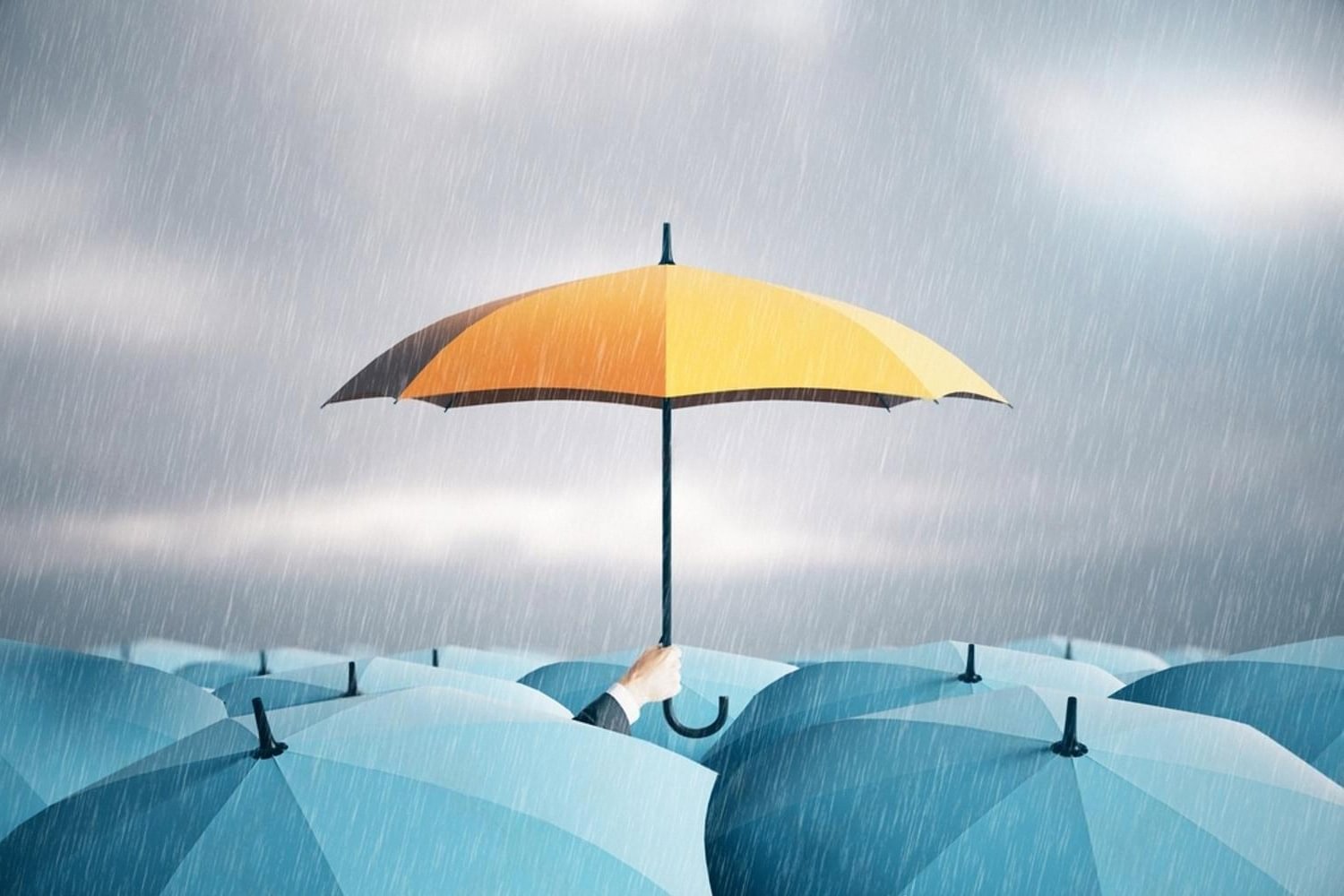 Yellow umbrella standing above blue umbrellas symbolising life insurance protection in the UAE