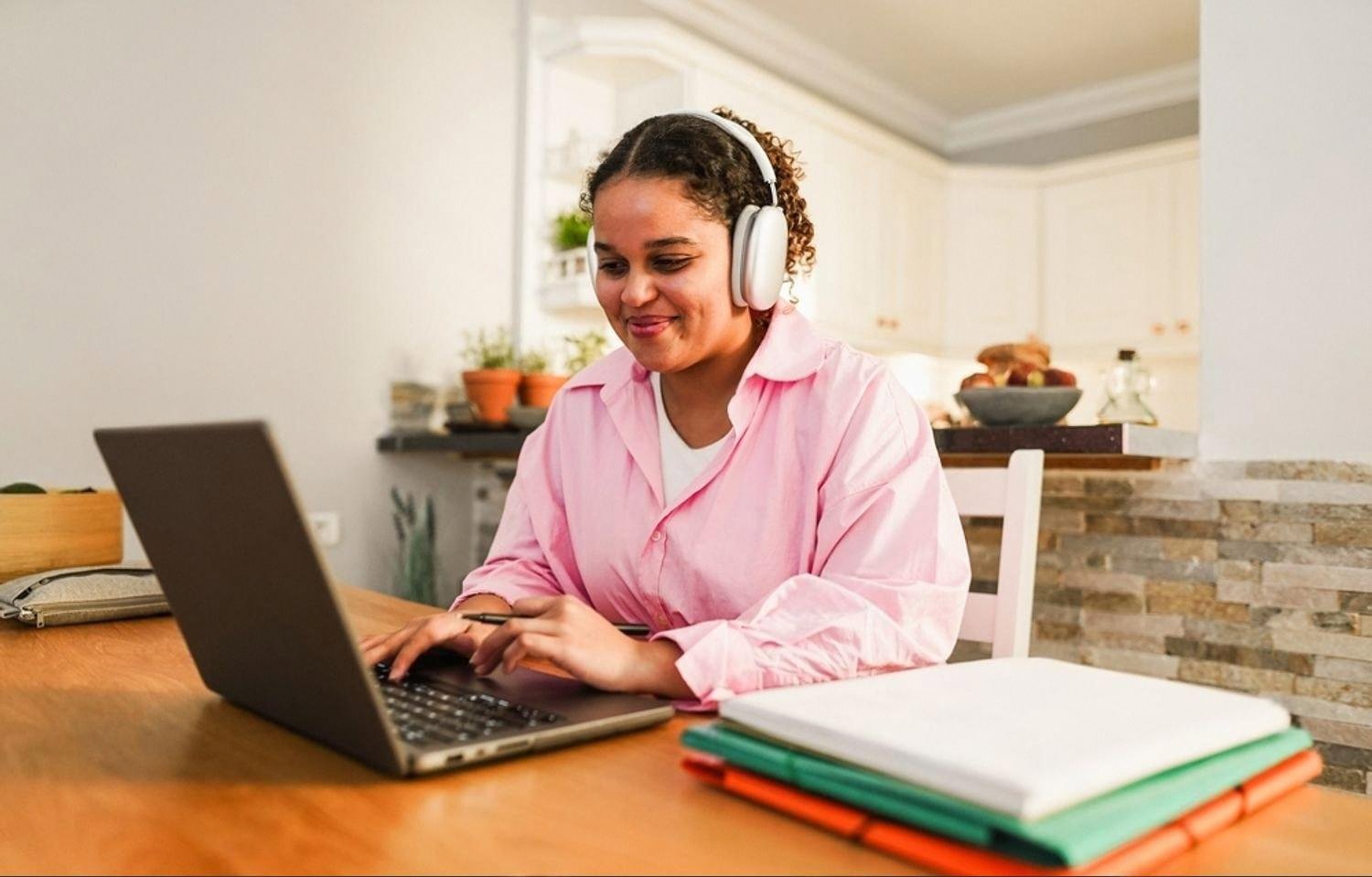 Woman managing rental equipment enquiries in Dubai from a home office